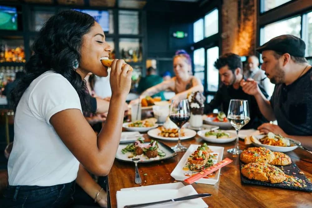 Group of people eating gluten free food at a restaurant